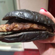Illustration for article titled Burger King's all-black burger looks absolutely disgusting in real life